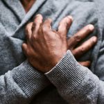 An older person experiencing chest pain