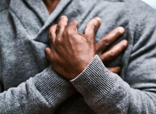 An older person experiencing chest pain