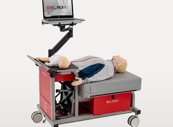 A CPR training manikin on a simulation station