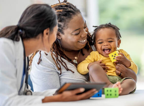 Healthcare Professional with a mother and son.
