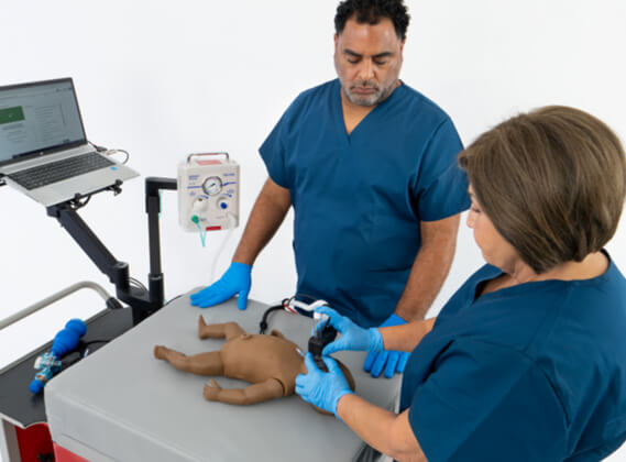 Nurse training and practicing infant CPR on a simulation mannequin