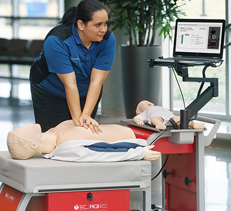 Nurse practicing CPR